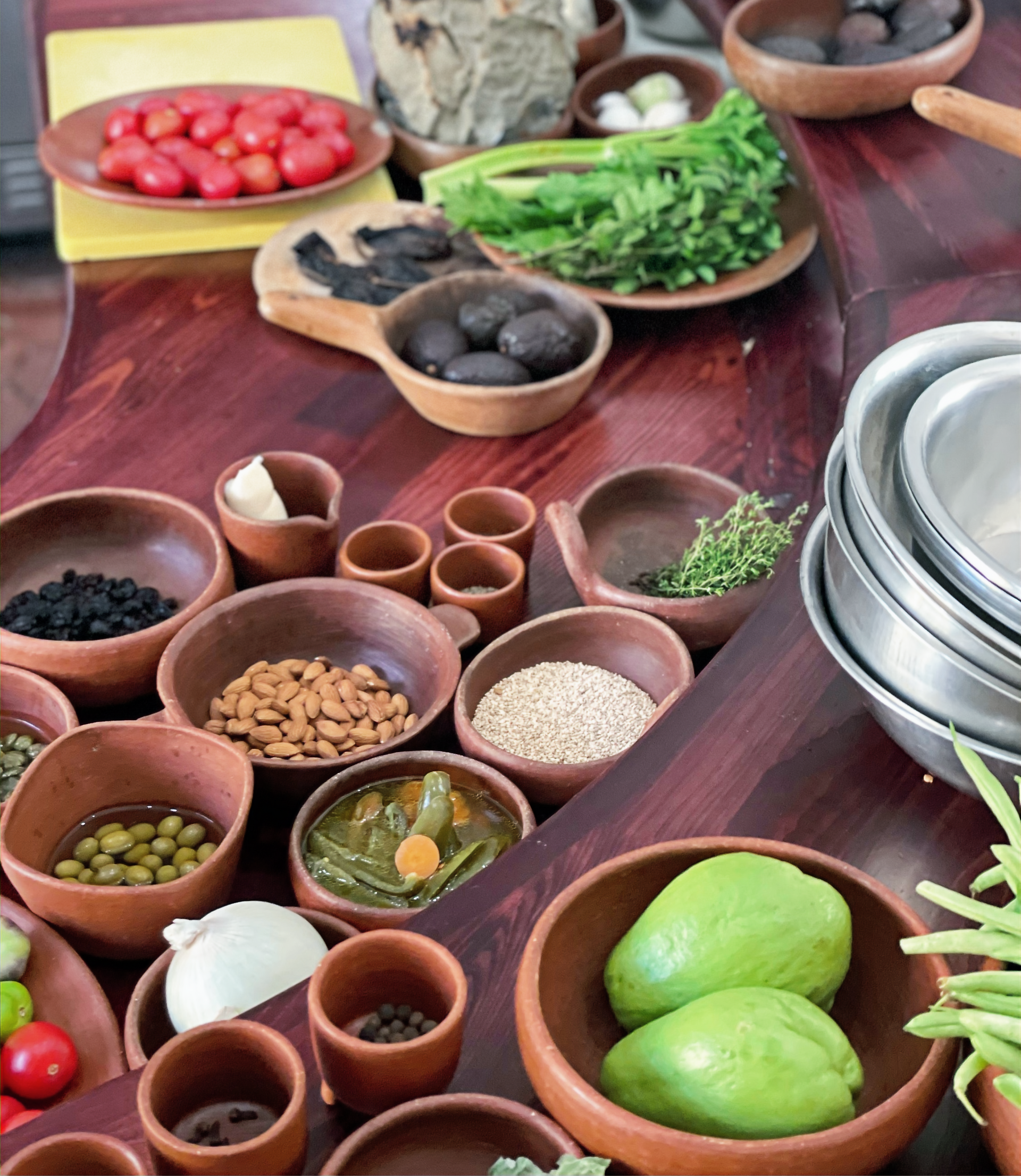 Gathering ingredients for a Oaxacan mole recipe on a kitchen counter, in bowls and proper amounts