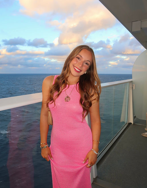 Mady Vivian in pink long dress on cruise