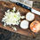 Thumbnail: White Onions on chopping board with knife