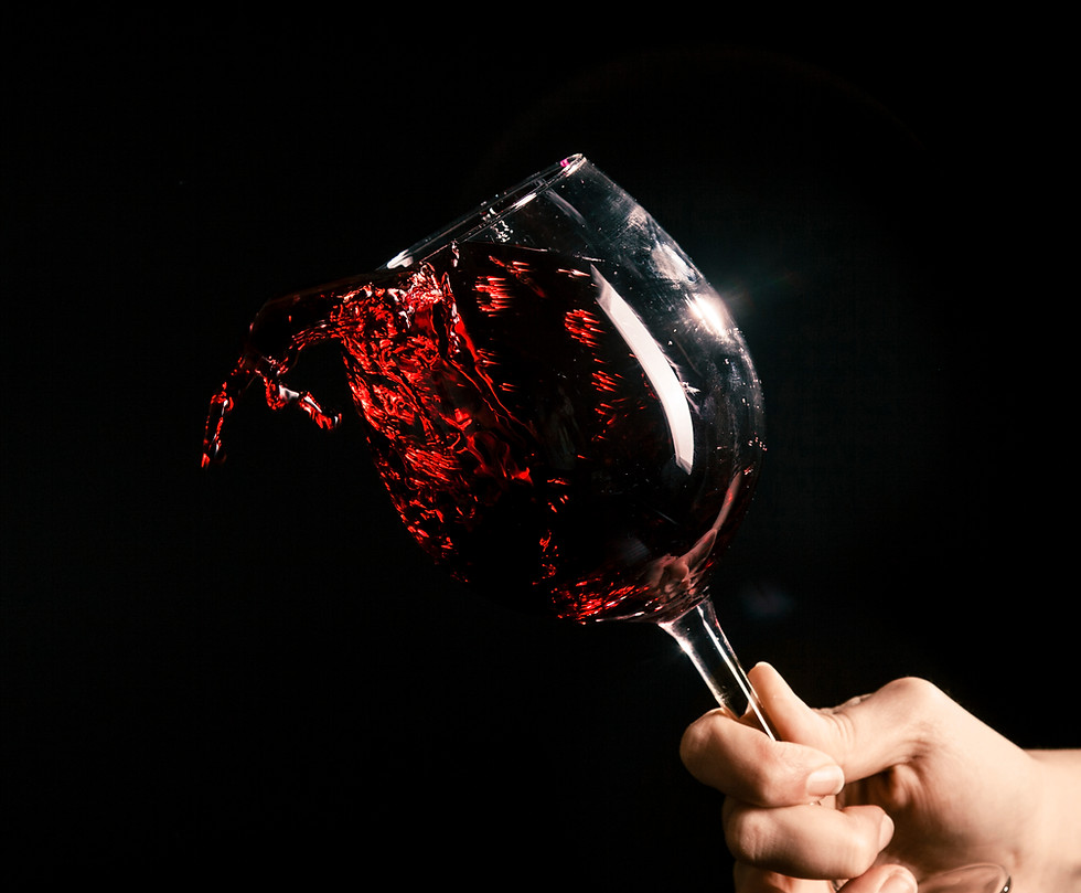 crop-hand-splashing-wine-from-glass.jpg