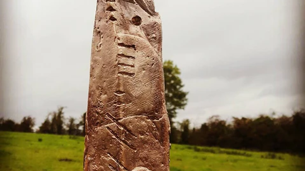 Standing stone with ogham markings.