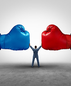 An imagine of a person standing between two giant boxing gloves and preventing them from hitting each other. Ruppert Law Firm believes in the collaborative divorce process, and will help