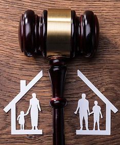 A judge's gavel splitting a house and family in half. Ruppert Law Firm LLC represents mothers and fathers in custody actions in Allegheny, Westmoreland, Washington, Beaver, and Butler County, Pennsylvania.