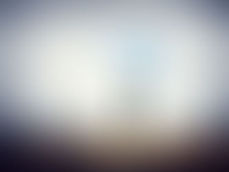 A person in a suit stands in a doorway with arms wide open, facing a sunny blue sky. A briefcase is on the ground, and the room is gray.