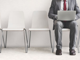 Professional preparing a structured response to an advertised board vacancy, reviewing application steps, documents, and governance credentials.