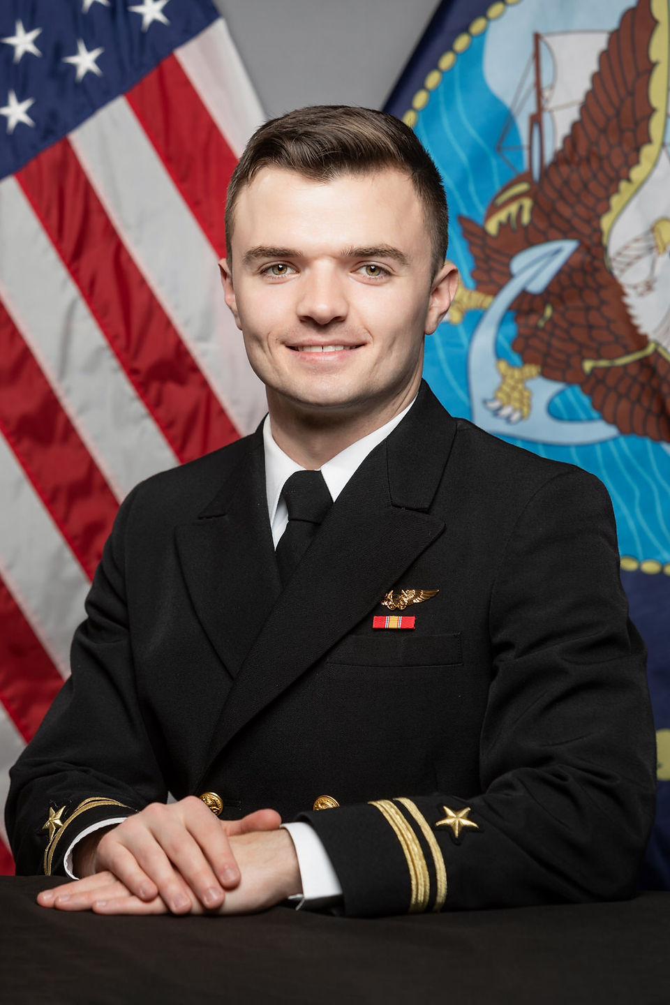 United States Navy Sailor Poses for Official Biographic Portrait in Service Dress Blues