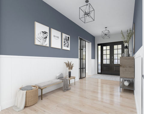 Open concept foyer and living room with light wood flooring