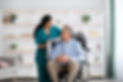 assisting-disabled-elderly-man-scaled.jpg