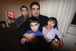 Refugees celebrate one year