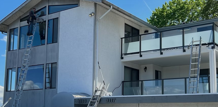 Husser technicians cleaning the exterior windows at a Queen Anne apartment building