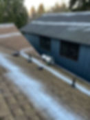 Detailed and targeted roof moss treatment on a North Seattle HOA roof by Husser.