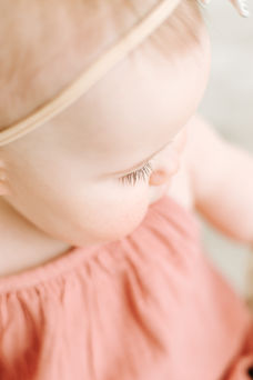 1 year old baby girl in pink dress