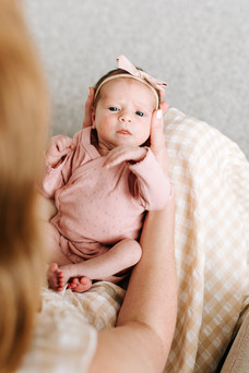 overhead shot of a woman holding a baby on her lap