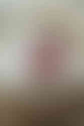 A baby lies in a bassinet