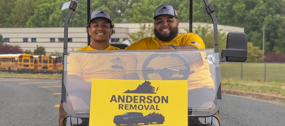 Fredericksburg's junk removal and demolition team in a golf cart.