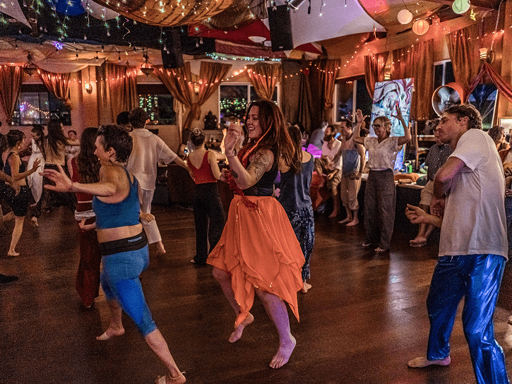 People in colorful outfits at ecstatic dance, Seattle Ecstatica