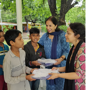 Happy students receiving their brand-new uniforms.tiff