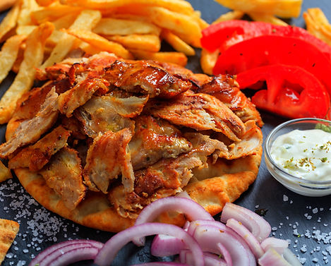 Greek gyros dish on a black plate_edited