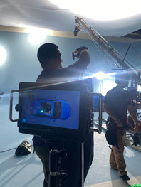 A behind the scenes photo of a BMW video production in Taiwan. Taipei's highest-rated bilingual video production company, Barker Production handled the creative, preproduction , production and postproduction. This photo shows our cinema camera Red Raptor, professional lighting, studio, model, styling, and grip equipment.