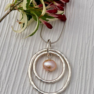 A selection of handmade silver jewellery, created using traditional silversmithing methods and with recycled sterling silver and semi precious gemstones.