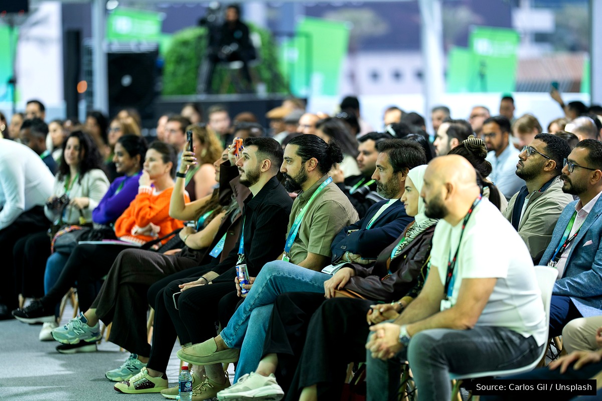 Audience at a professional Dubai conference, including MENA attendees, representing the event community and production scale a B2B event agency must deliver