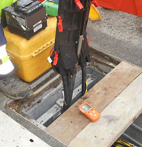 Underground utility chamber with civil engineering cable joint installation and gas detector used during underground safety and civil engineering training.