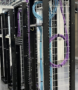 Structured copper cabling, patch panels and network equipment in a data cabinet during enterprise structured cabling training.
