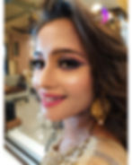 Creative editorial makeup with bold eyes and glossy lips