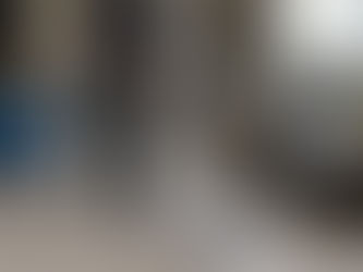 man steam cleaning carpet in living room