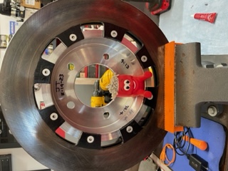 I cleaned and painted the old rotor and used new hardware and red loctite to secure it into place.