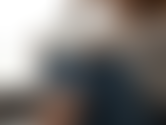 Woman hugging knees anxiously