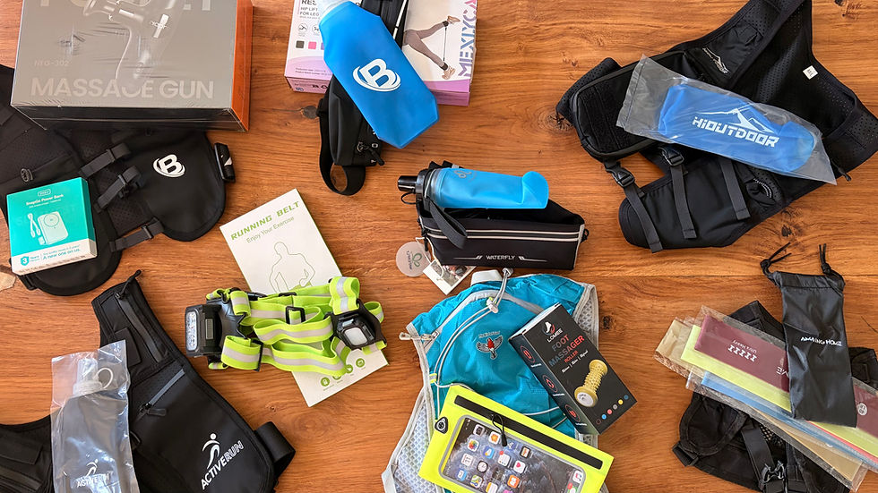 Assorted fitness accessories and massage tools on a wooden table, with bright blue, black, and neon green packaging and belts.