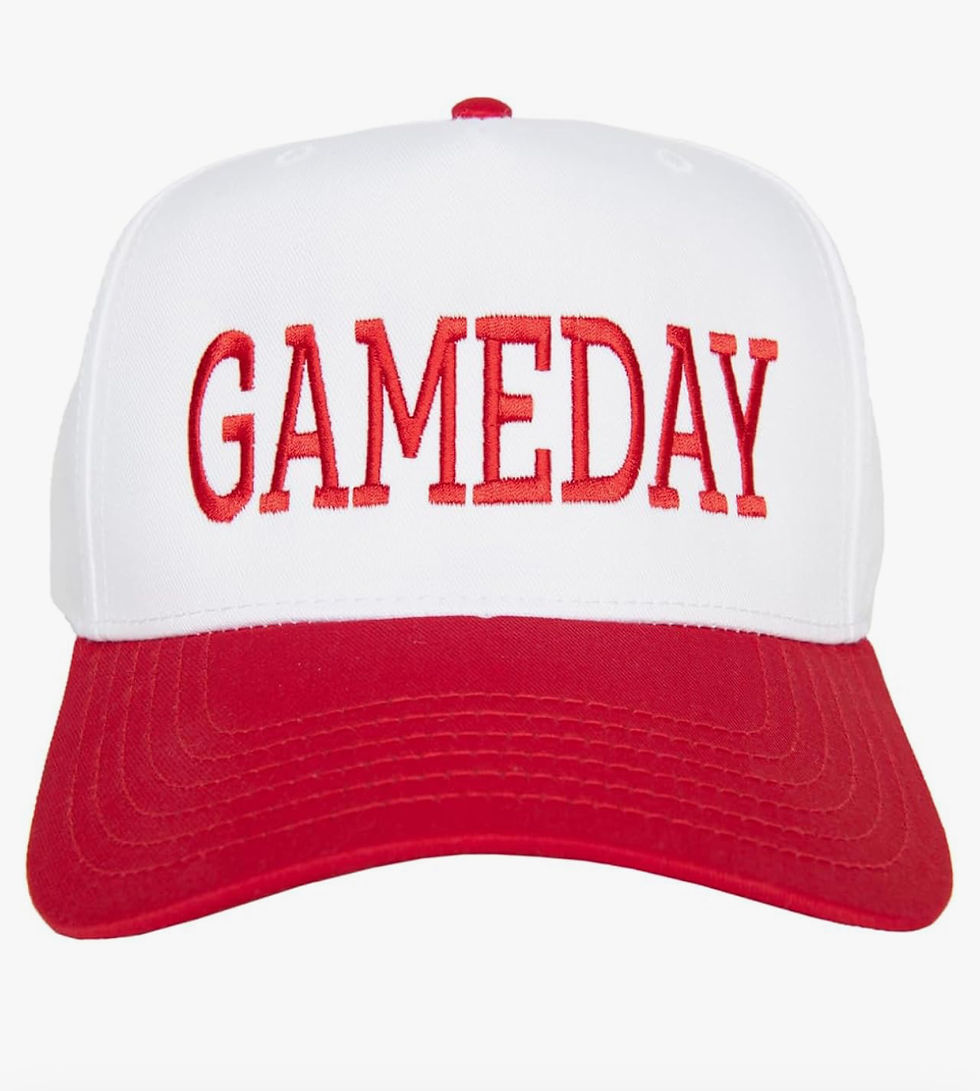 White and red trucker hat cap with "GAMEDAY" text in red on front. Red brim, white crown. Simple, sporty design, set against a plain background.