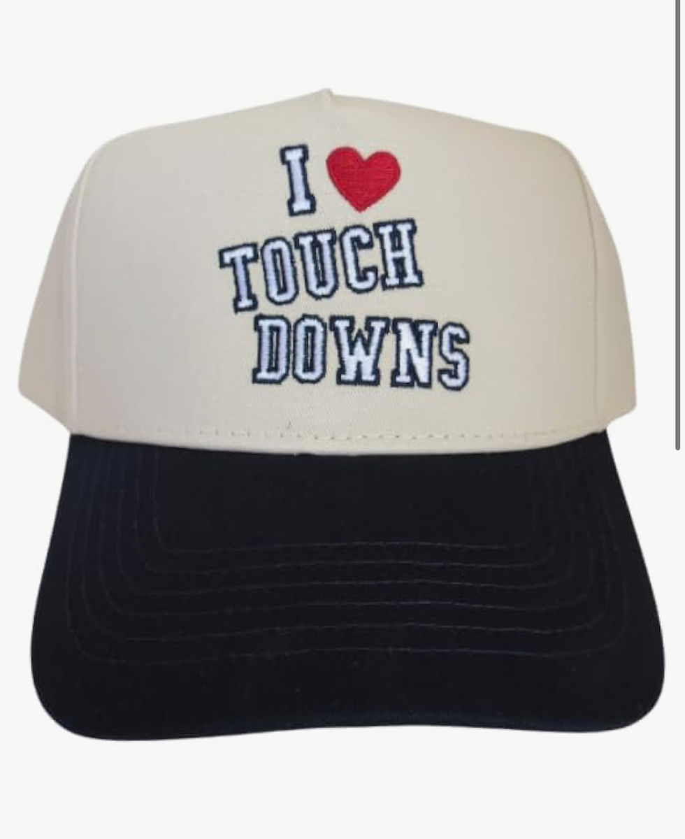 A tan and black trucker hat cap with text "I ❤️ TOUCH DOWNS" embroidered on the front. The cap is on a plain white background.