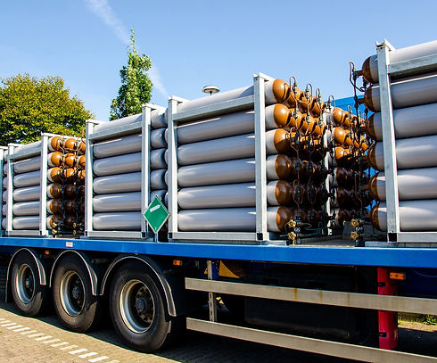 Gas cylinders loaded on a truck for delivery, highlighting the company's friendly and reliable service.