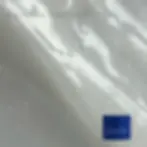 TOUCH brand blue cap on shiny surface