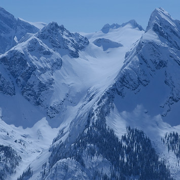 Snowy Monashee Mountains with white text over top