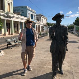 Men standing with statue
