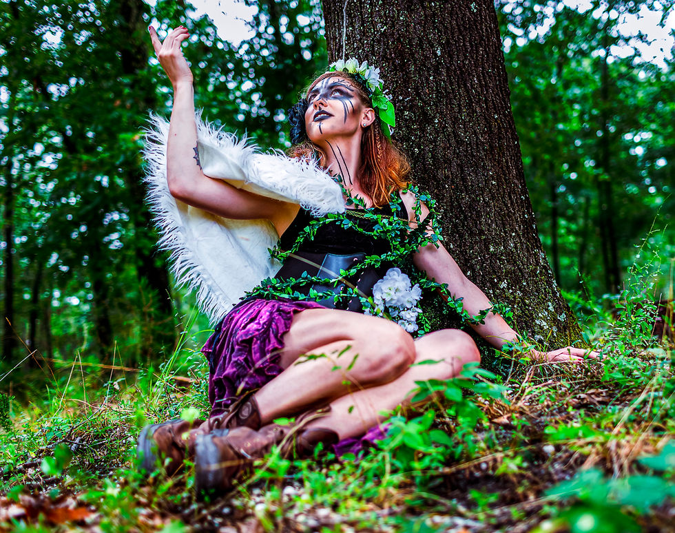 A nomadic inspired photo of a woman with her hand reaching into the air in the pine barrnes from a photoshoot in New Jersey