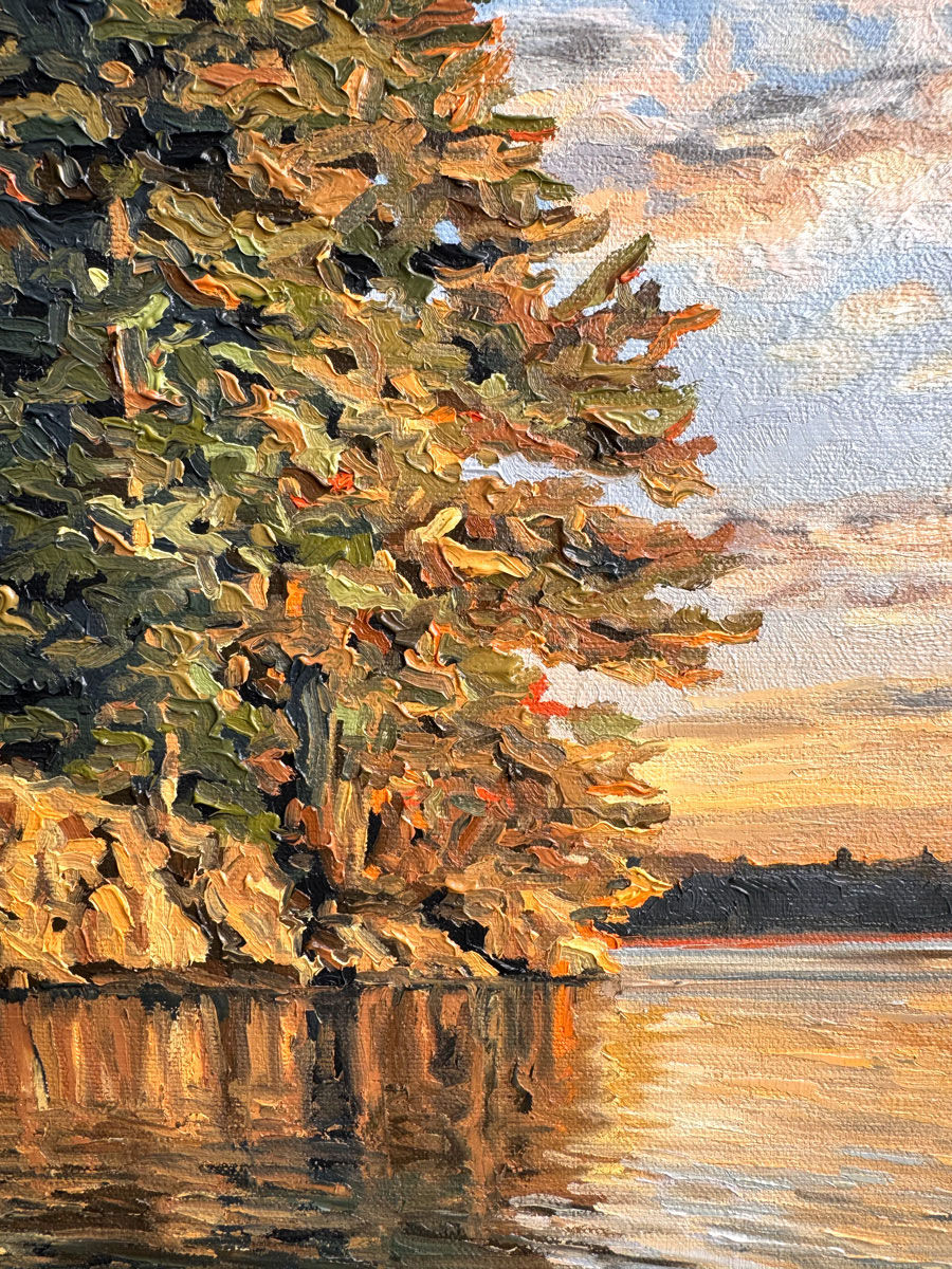 Detail of Almost Heaven, an original Canadian landscape oil painting of a peaceful sunrise over a calm lake with glowing trees and shoreline rocks