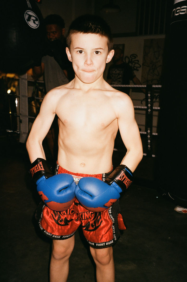 Young boxer inside the ring at Traphouse Boxing Gym