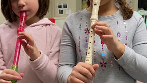 2 kids showing off their recorder skills!