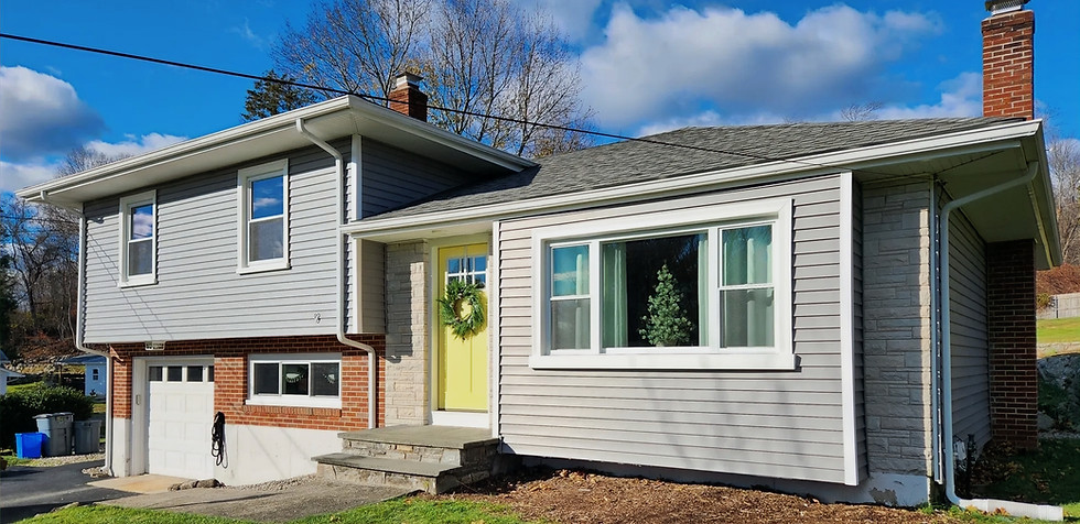 Exterior remodeling featuring new roof and vinyl siding