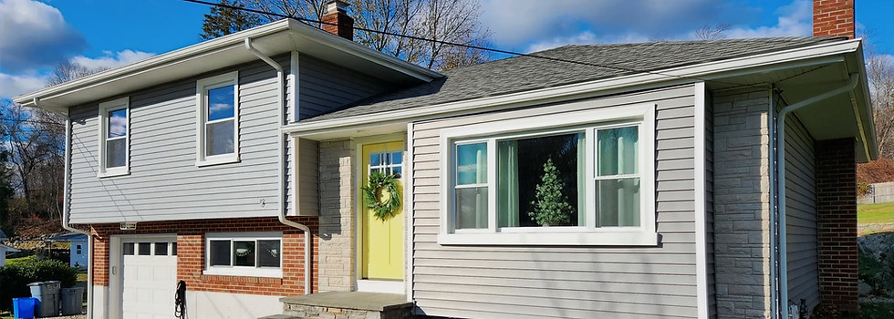 Vinyl siding installation on Massachusetts coastal home