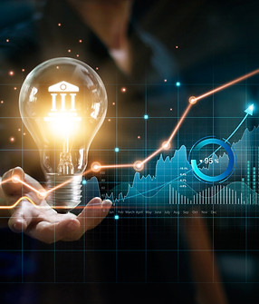 Lovepik_com-480029364-Businessman holding creative light bulb with growth graph and bankin