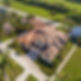 Aerial photo of roof being repaired.