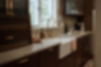 Unlacquered Brass Victorian Sink in European-Inspired Dark Wood Kitchen
