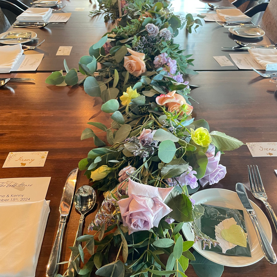 Elegant floral centerpiece adorns long table