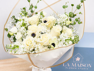 White and cream sympathy flower bouquet with roses and anemones
