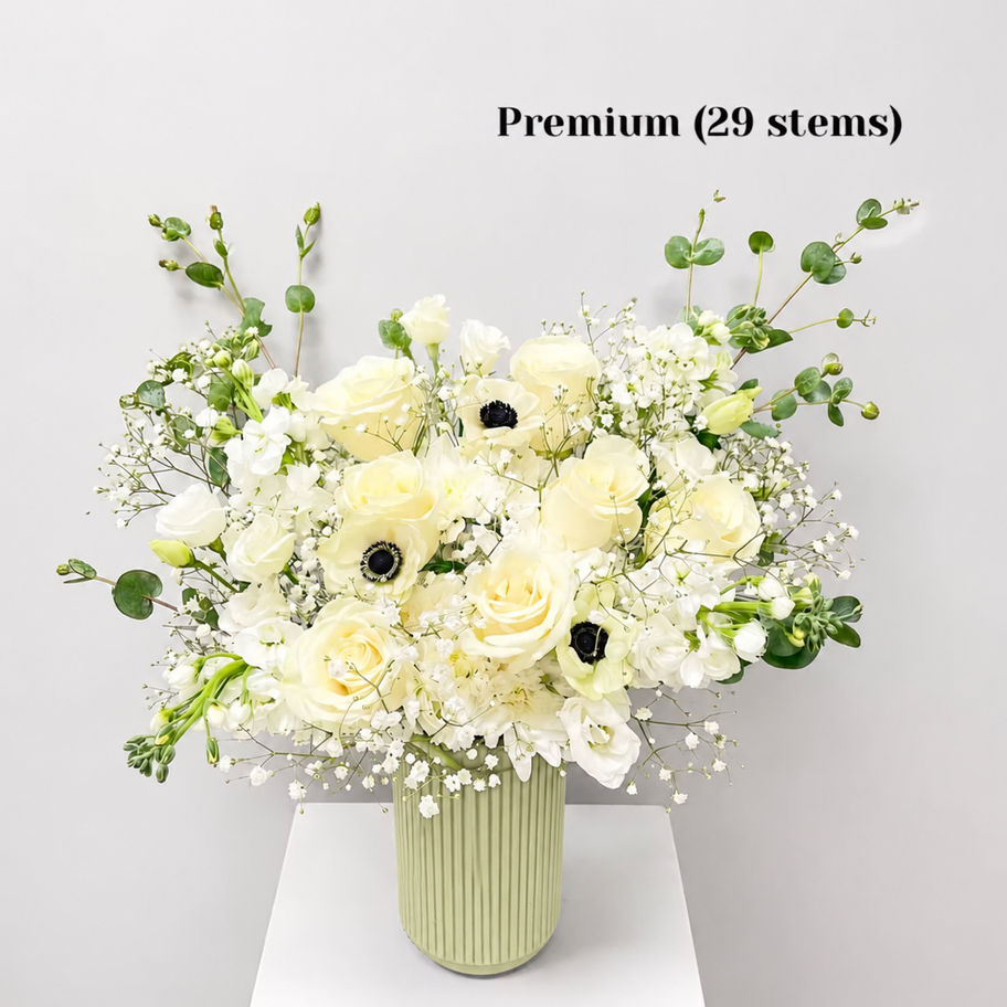 White Tea white & green flower bouquet arranged in a ceramic vase